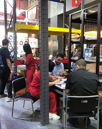Overseas procurement delegation discussing warehouse layout
